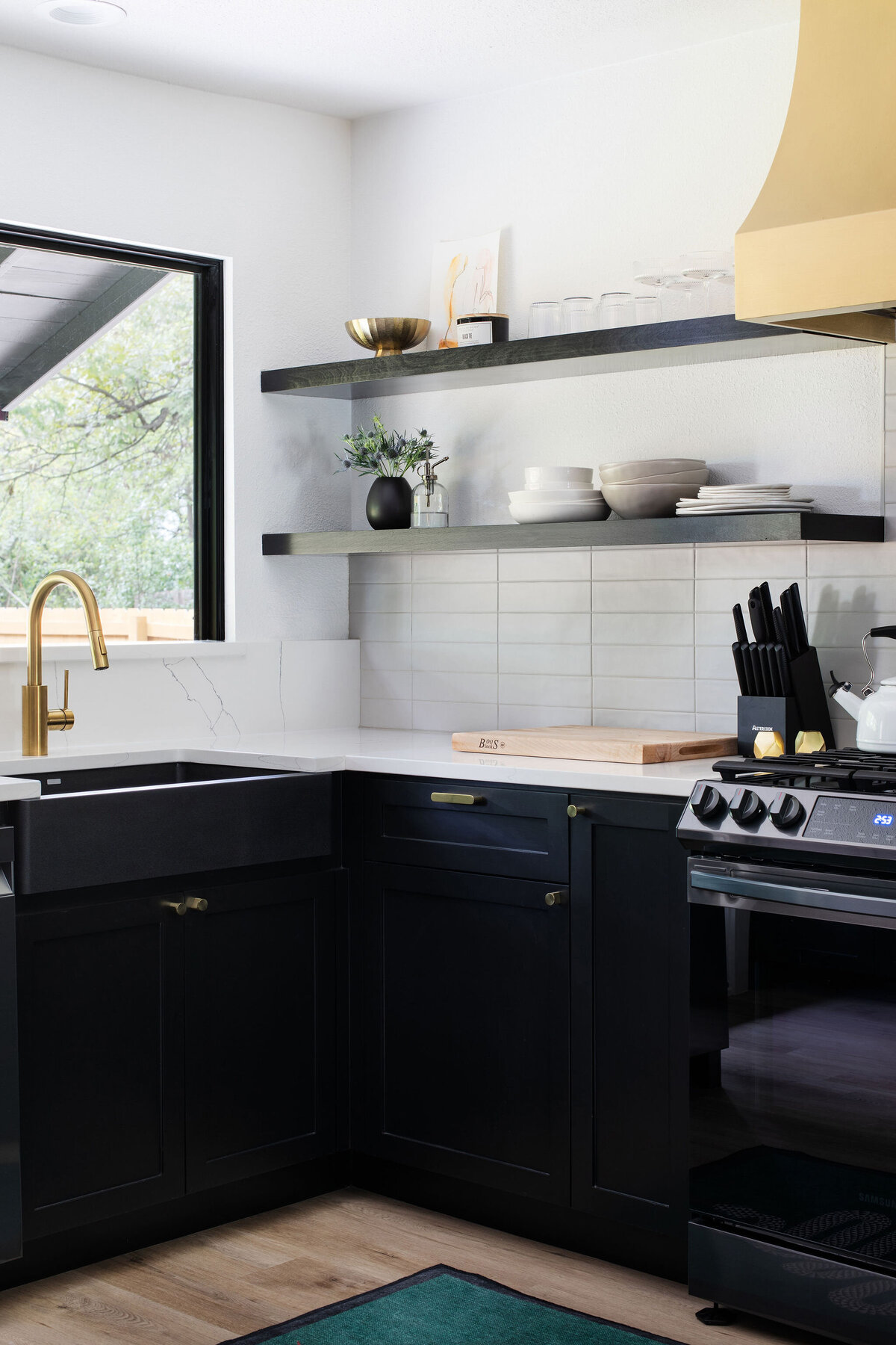 modern chic posh kitchen black and brass remodel rental design 7