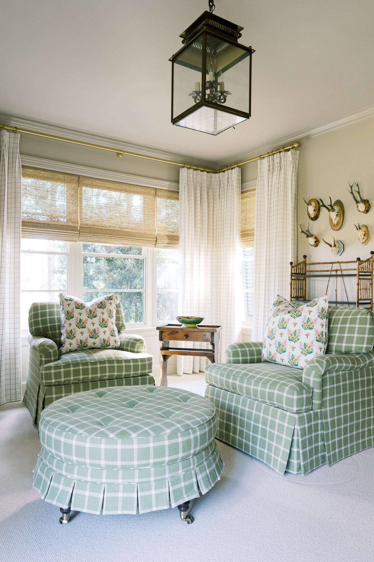 oyster creek studios happy valley green plaid seating and ottomon in living room