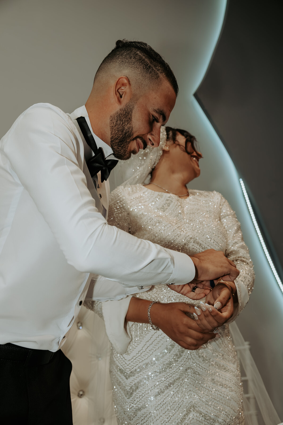 Bride and Groom Laughing While Serving Cake – Arabic Wedding Photography in LA