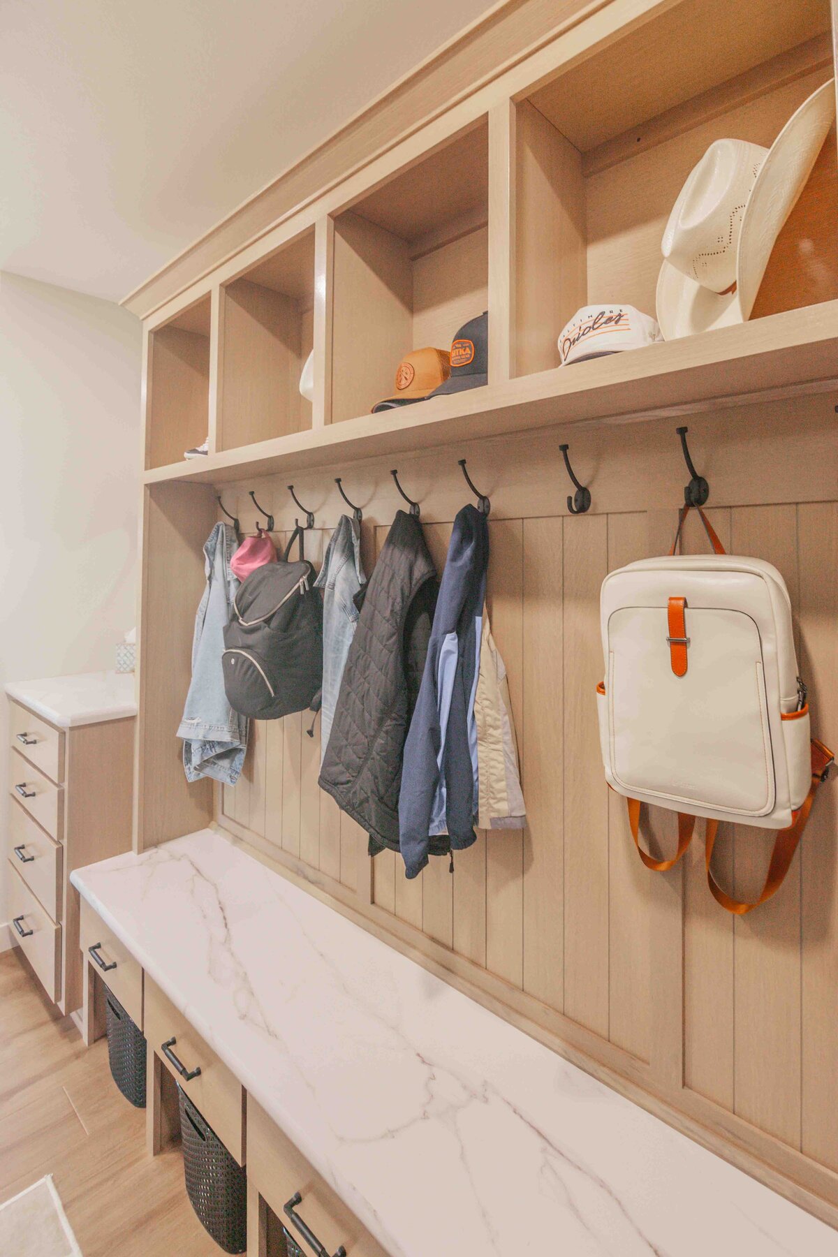 backpacks hanging in mudroom