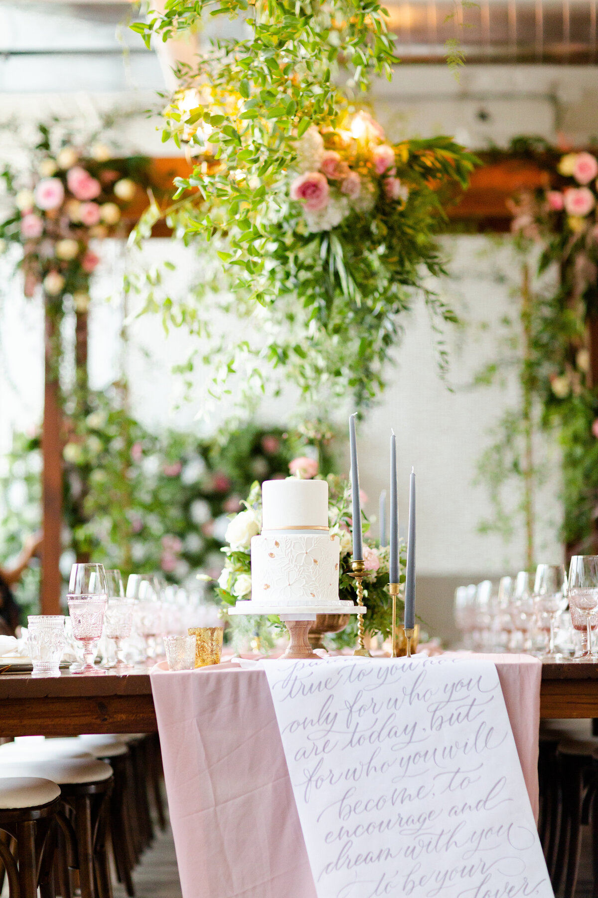 cake on table with hand drawn scroll for wedding