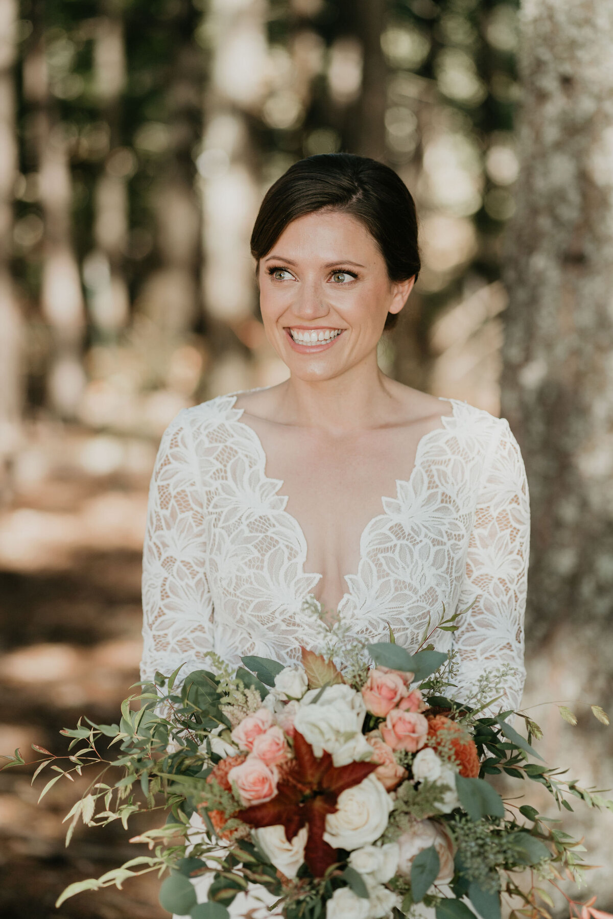 Bride holding bouquet and smiling