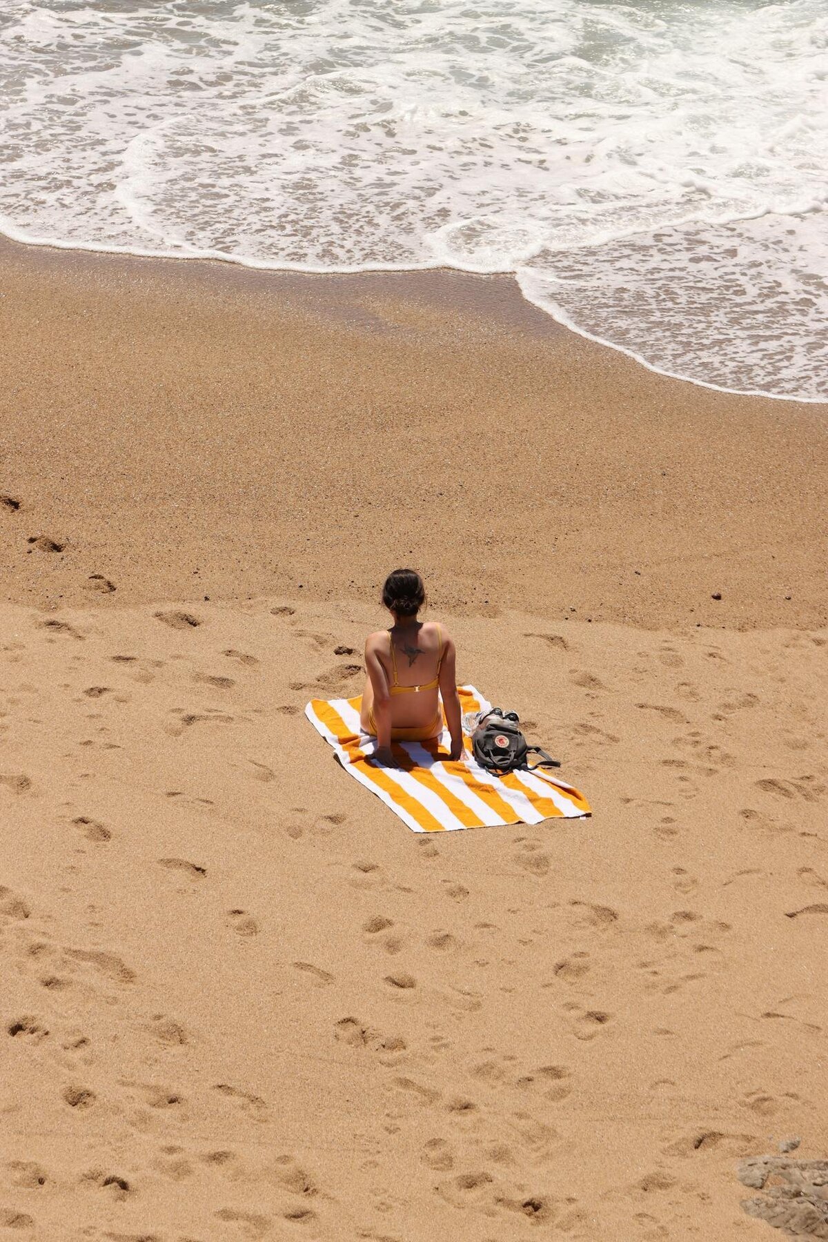 alone on a beach towel