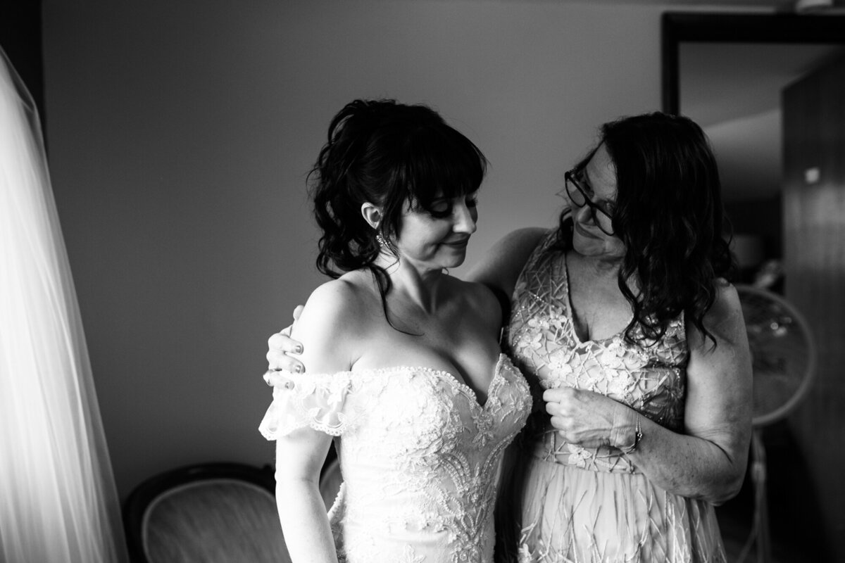 Mom and bride share a moment before the wedding ceremony