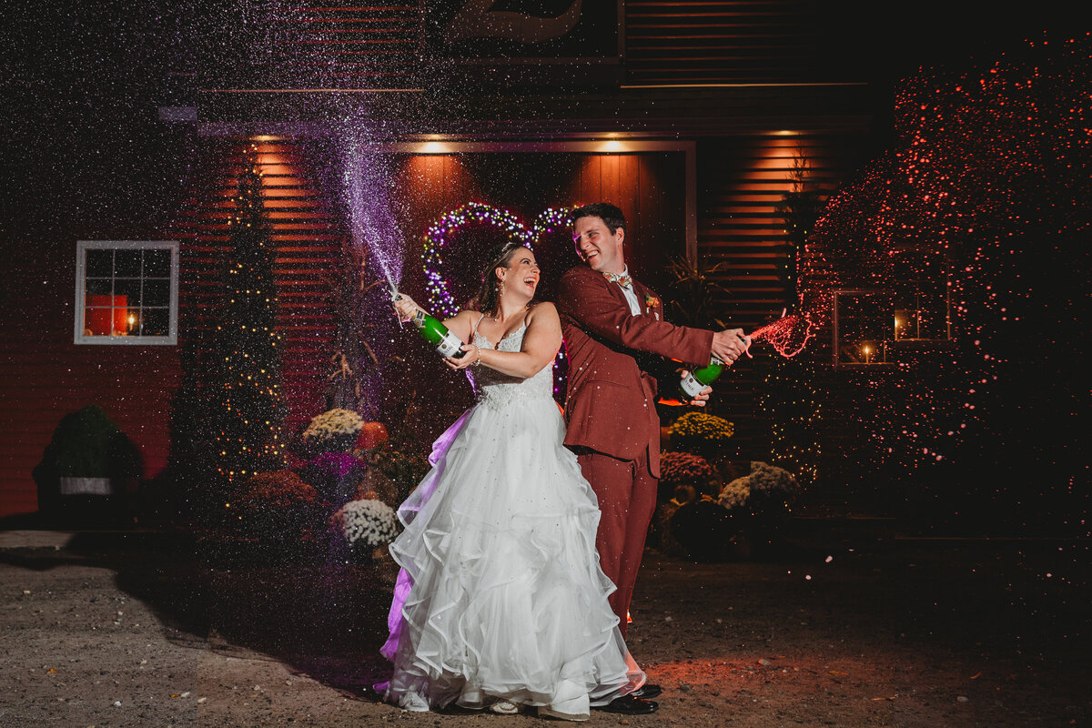 wedding couple popping champagne