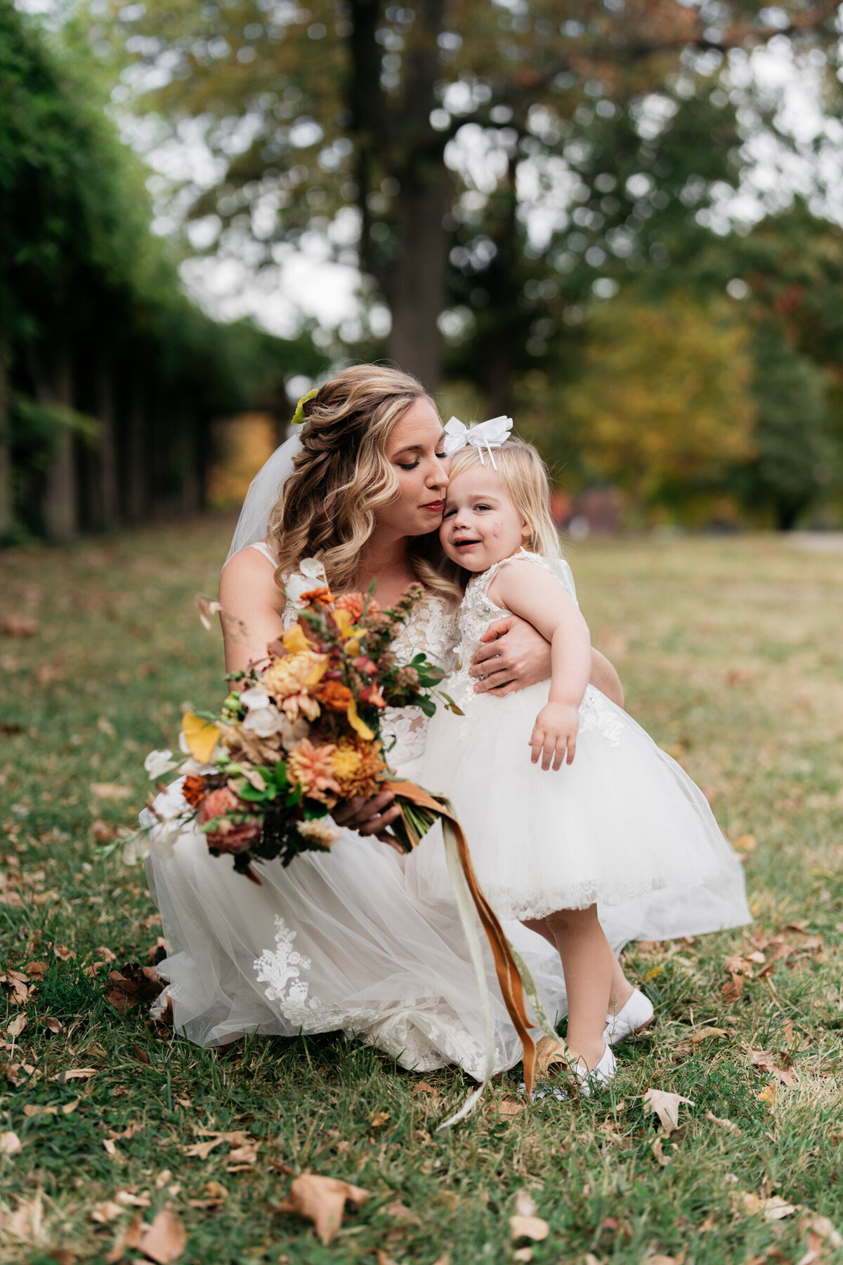 portrait of a bride and flower girl