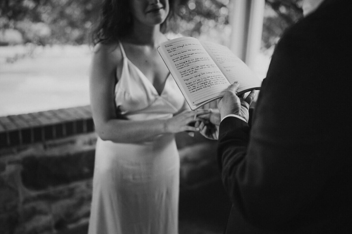 Groom reads his vows on porch of home in Maryland