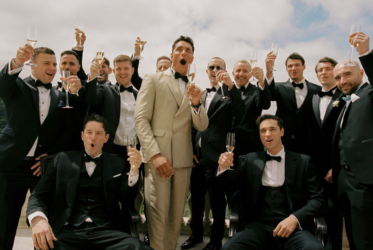 The groom and his groomsmen are celebrating together for his destination wedding in Quinta da Bellavista