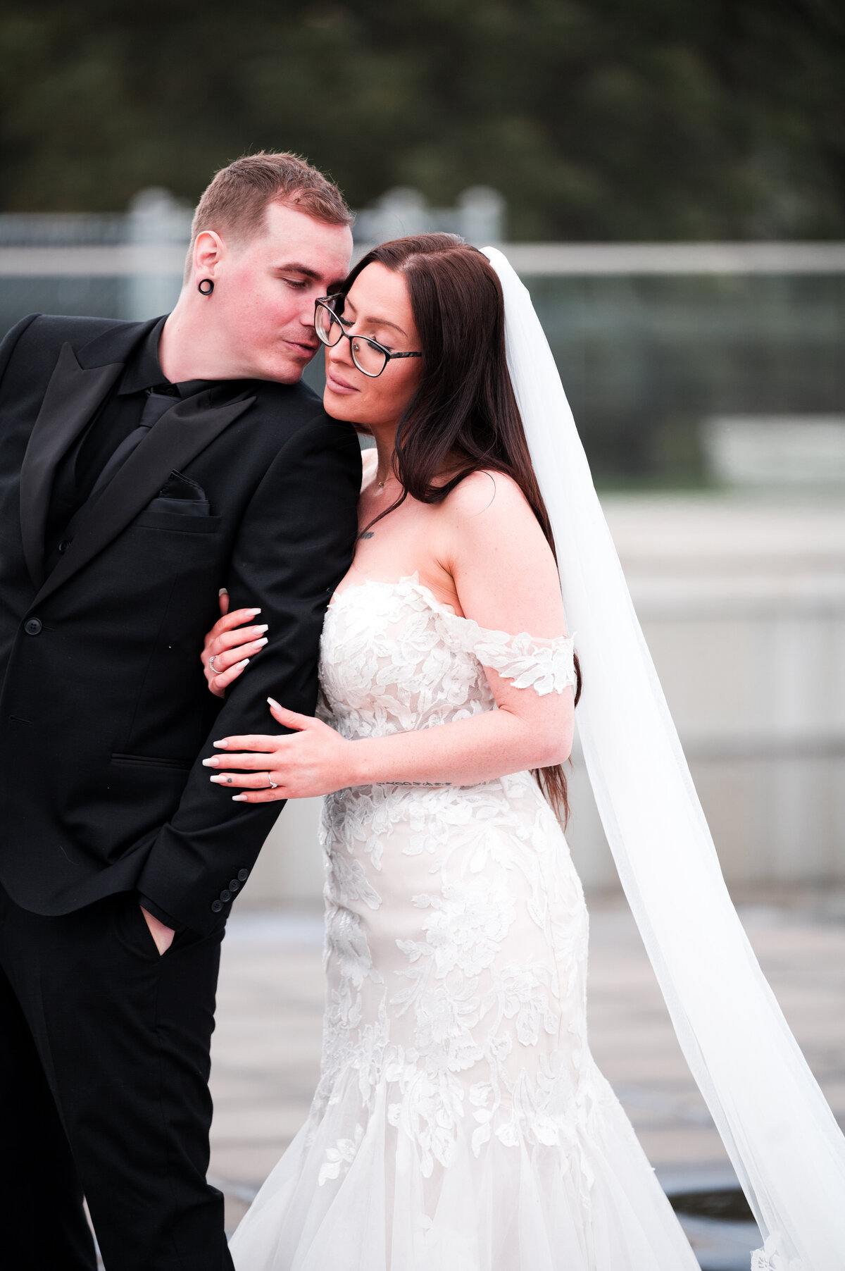 groom kisses his bride on the cheek