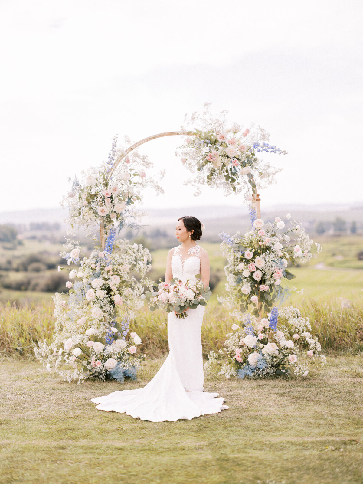 calgary-wedding-blue-blush-ceremony-floral-arch
