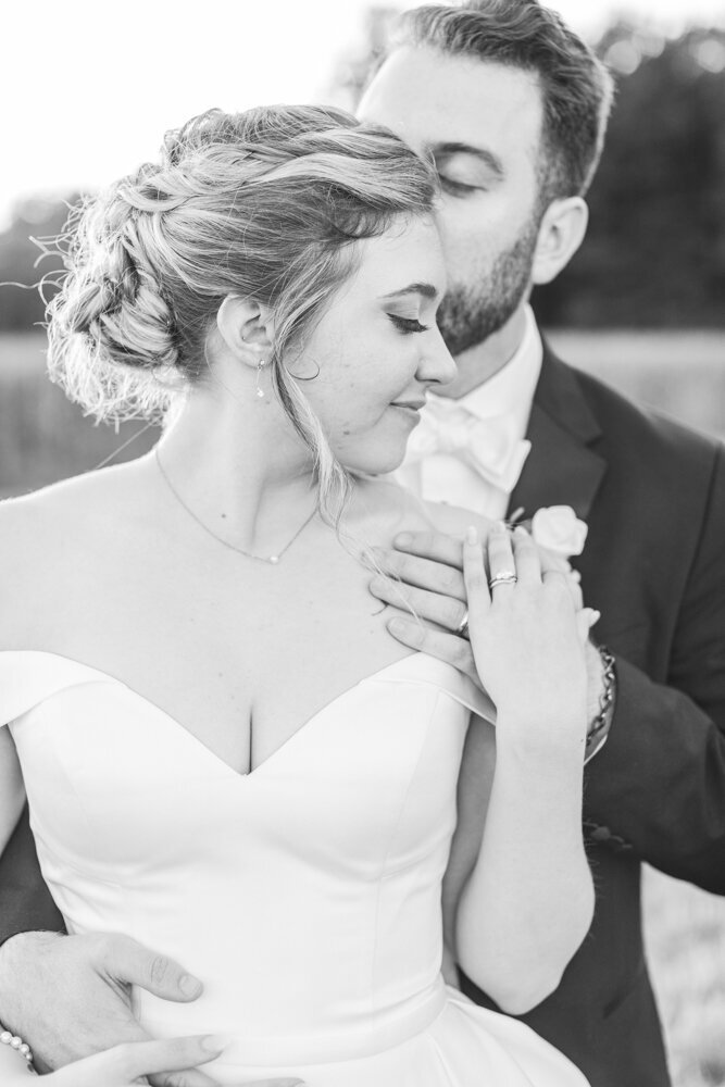 bride and groom embracing