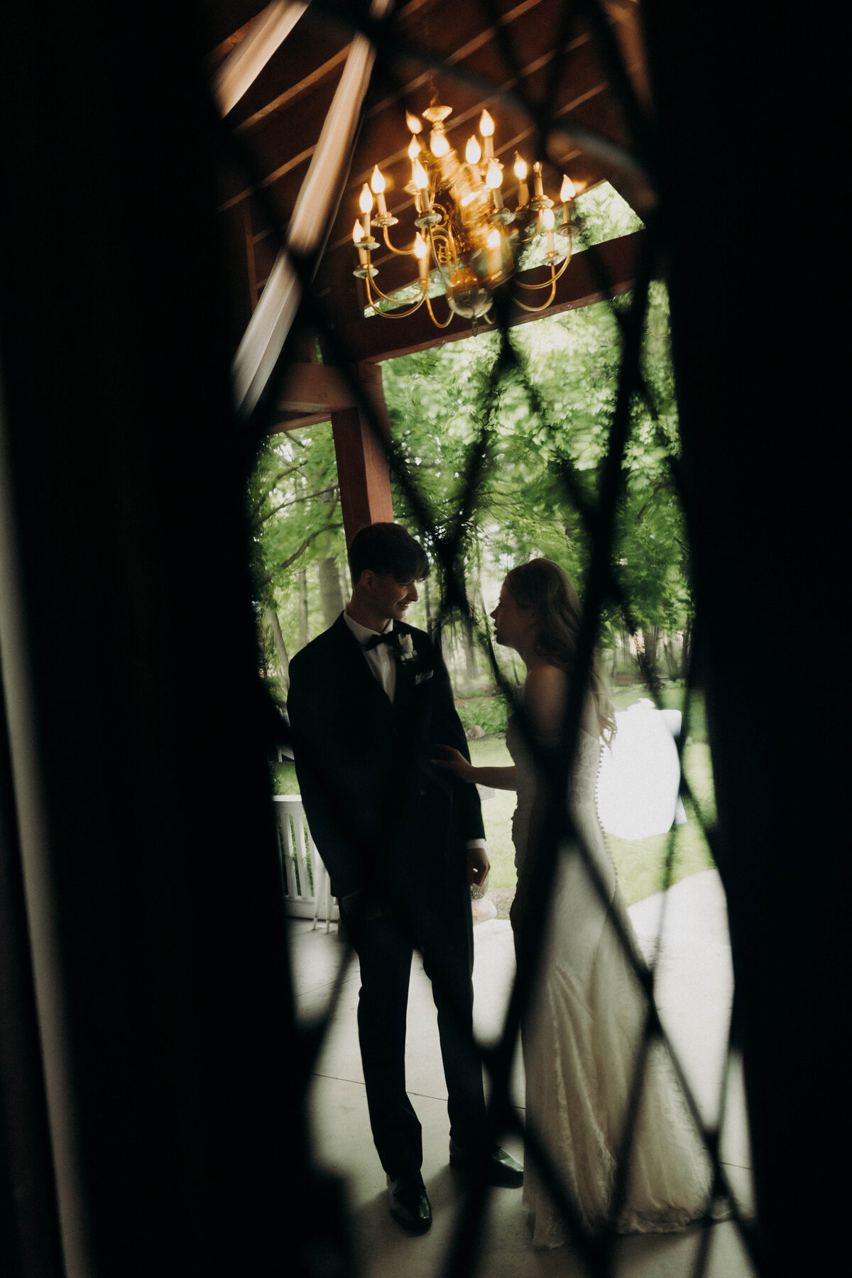 through the window bride and groom artistic photography 