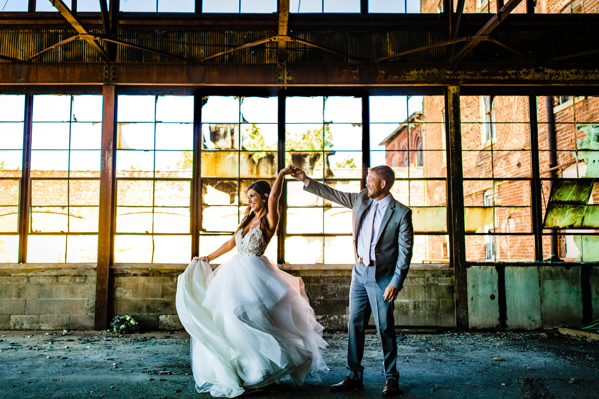 One of the top wedding photos of 2020. Taken by Adore Wedding Photography- Toledo, Ohio Wedding Photographers. This photo is of a bride and groom dancing at the Venues wedding venue in Toledo Ohio