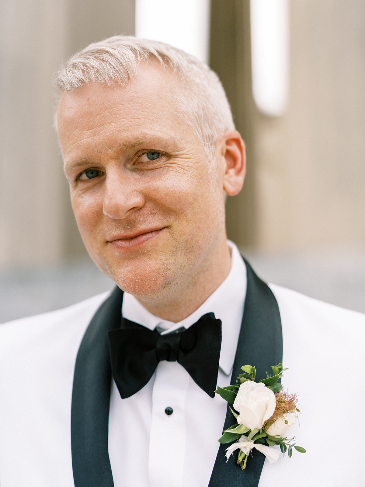 This romantic summer solstice wedding held at the elegant War Memorial was filled with pops of cherry red, pink and white flowers and lush greenery. Floral Design by Rosemary and Finch in Nashville, TN.