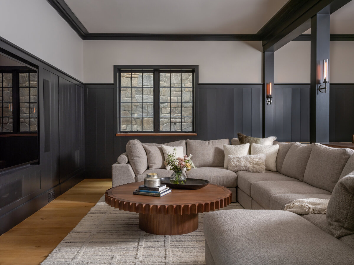 blue wood walls in living room with sitting area