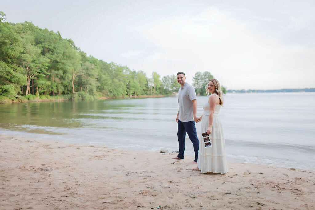 Couple making a pregnancy announcement maternity photo session in Lake Norman