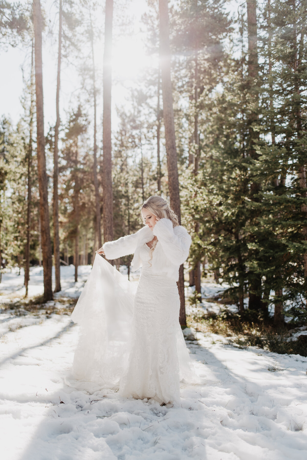 Jackson Hole Photographers capture bride playing with dress