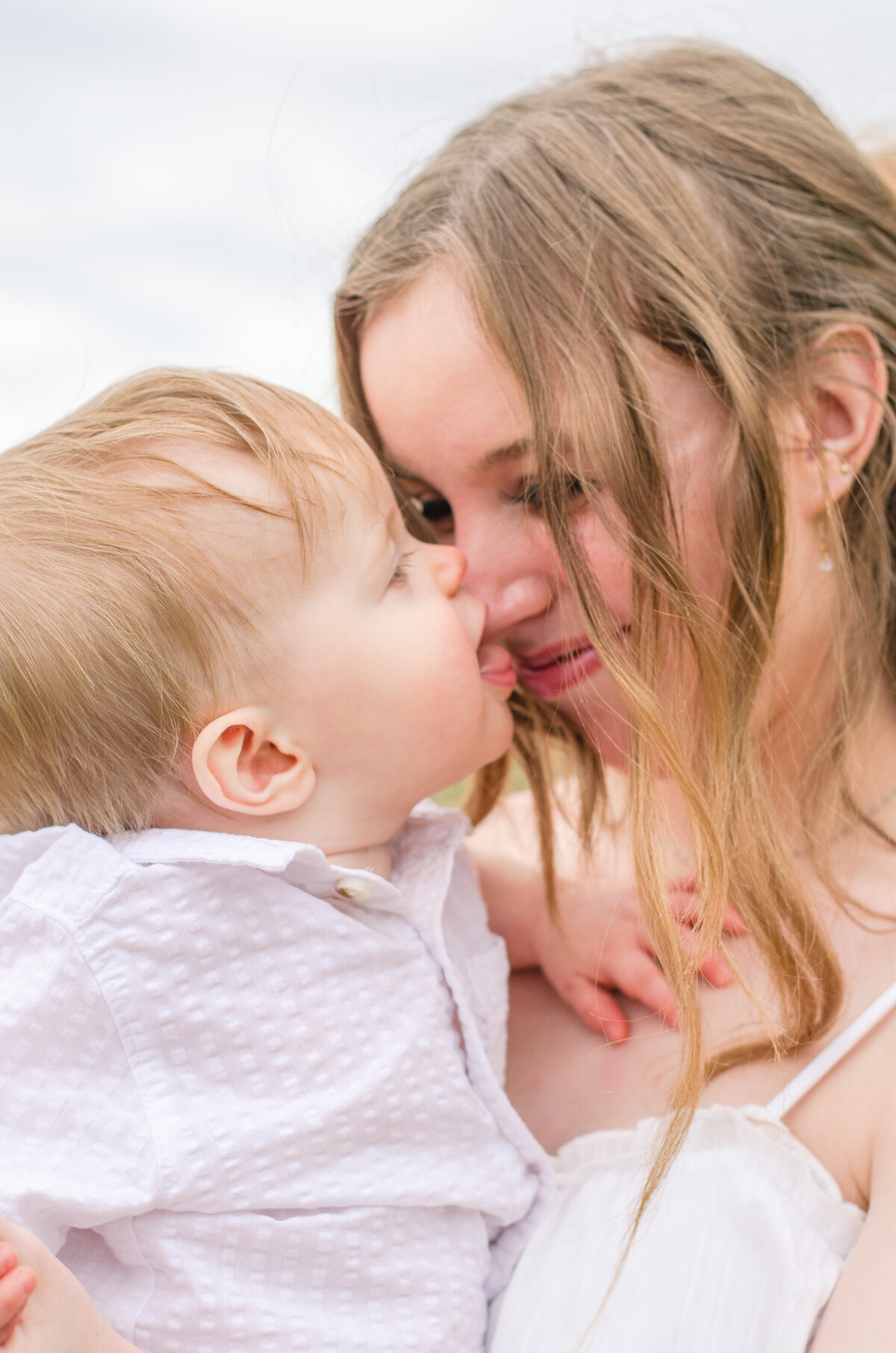 baby boy gives mom a kiss