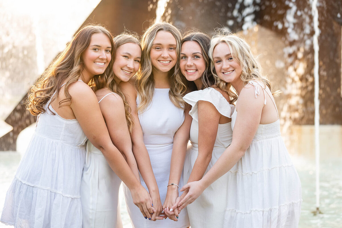 Close up of five girls during their college graduation portrait session.