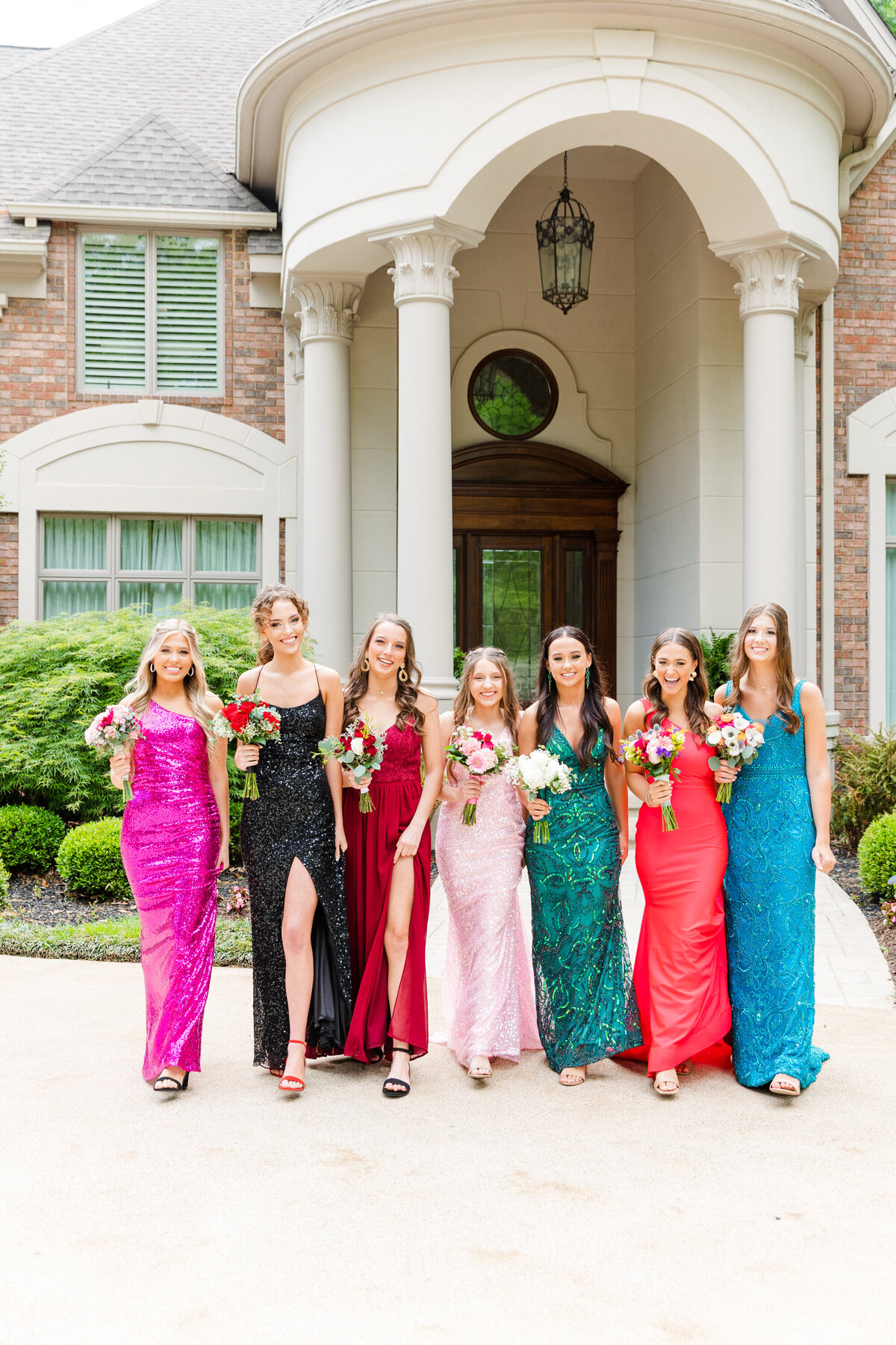 girl prom group walking with bouquets in Cleveland, TN