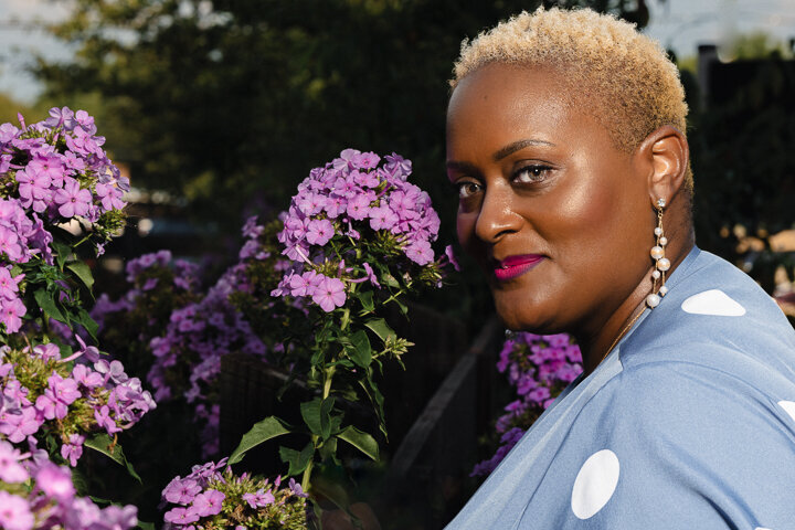 Black female blue dress flowers