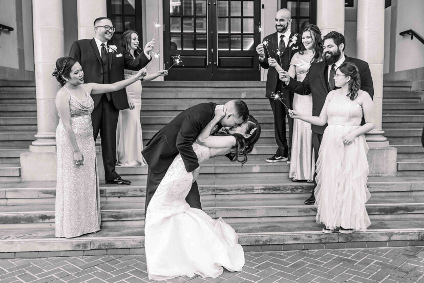 bride-and-groom-kissing-on-steps-of-the-guild-hotel-san-diego