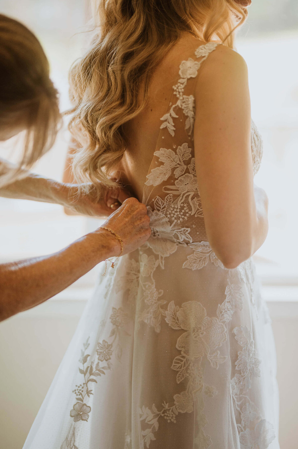 A bride getting into her wedding gown in Lake Tahoe.