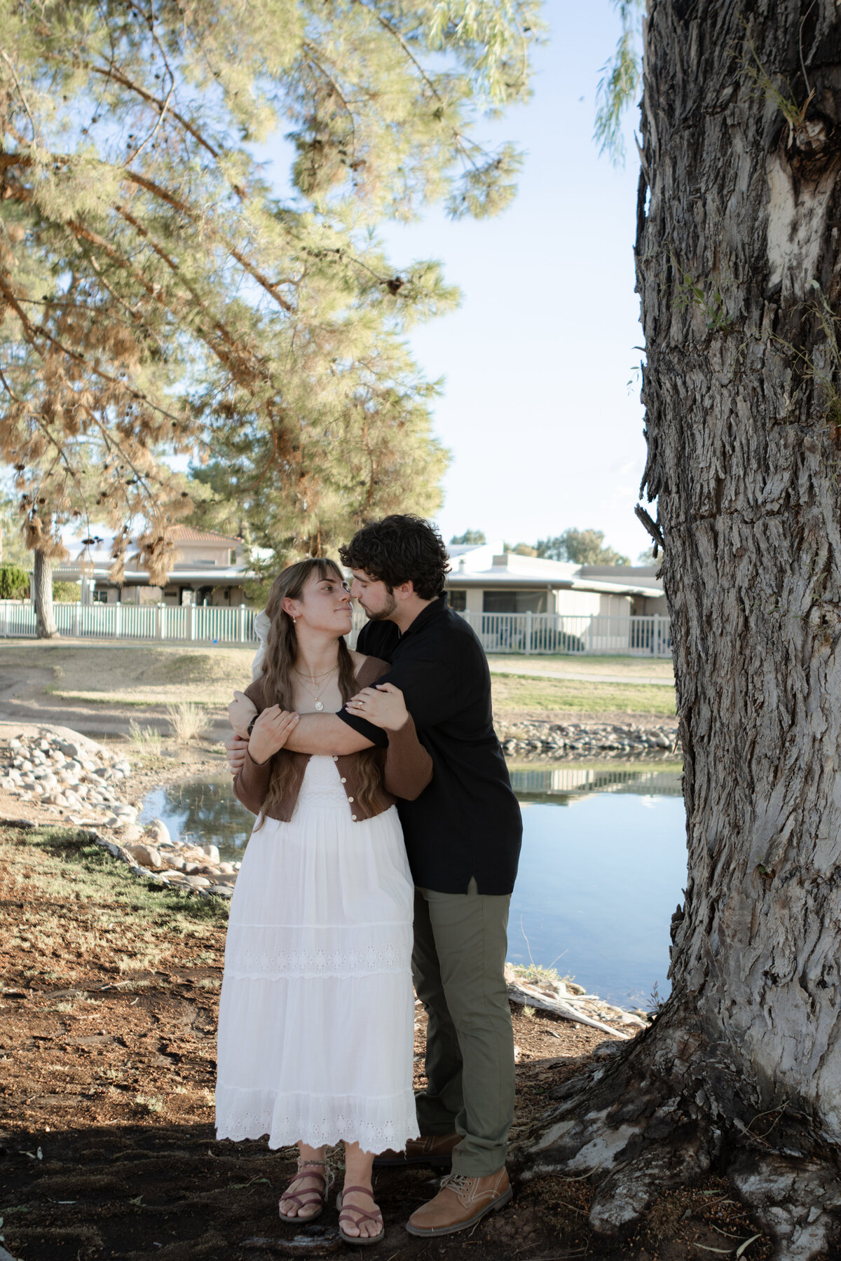 Jovanna G Photography. Classic, sophisticated Wedding Photos. Soft romantic engagement photos. Soft romantic WeddingPhotos. Sophisticated Wedding Photographer. Professional Wedding Photographer. Destination Wedding Photographer. Luxury Wedding photographer. Traveling Wedding Photographer. AZ Wedding Photographer. Gilbert AZ Wedding Photographer. Queen Creek Wedding Photographer. Phoenix Wedding Photographer. Scottsdale Wedding Photographer. Flagstaff Wedding Photographer. SoCal Wedding Photographer. California Wedding Photographer. Northern California Wedding Photographer. Southern California Wedding Photographer. San Francisco Wedding Photographer. Bay Area Wedding Photographer. San Jose Wedding Photographer. Golden Gate Bridge Wedding Photographer. Beach Lover Wedding Photographer. Palace of the Fine Arts Wedding Photographer. Ocean Lover. I love California. Orange County Wedding Photographer. Newport Beach Couples Photographer. Newport Beach Wedding Photographer. Laguna Beach Couples Beach Engagement Photographer. Laguna Beach wedding beach photographer. Los Angeles Wedding Photographer. Young and in love engaged couples who live in southern California. Christian Young Couple. Young Engaged Couple. Engaged High School Christian Couple. Christian Values. Young conservative Christian women. Young Conservative Christian men. Young Conservative Christian Couple. Young Christian Couple Engaged in High School. Young Christian College Couple. Lakeside Lovers in the Autumn Sun. David & Grace - engagement photos. Jovanna G Photographer Engagement Photos. Arizona sun shining through autumn trees- engagement. Chandler, AZ Engagement Photos. Chandler, AZ 2026 bride. Chandler, AZ Wedding Photographer. Chandler, AZ Young Engaged Couple. Girl in her 20s. Engaged Arizona Girl in her 20s. Lakeside Engagement photos. AZ Lakeside Engagement Photos. AZ Weeping Willow Lakeside Proposal. Arizona Lakeside Proposal with weeping willow tree. Detail shot of engagement ring on Arizona Lakeside estate. Chandler, AZ Lakeside Estate Proposal Outfit Inspiration.