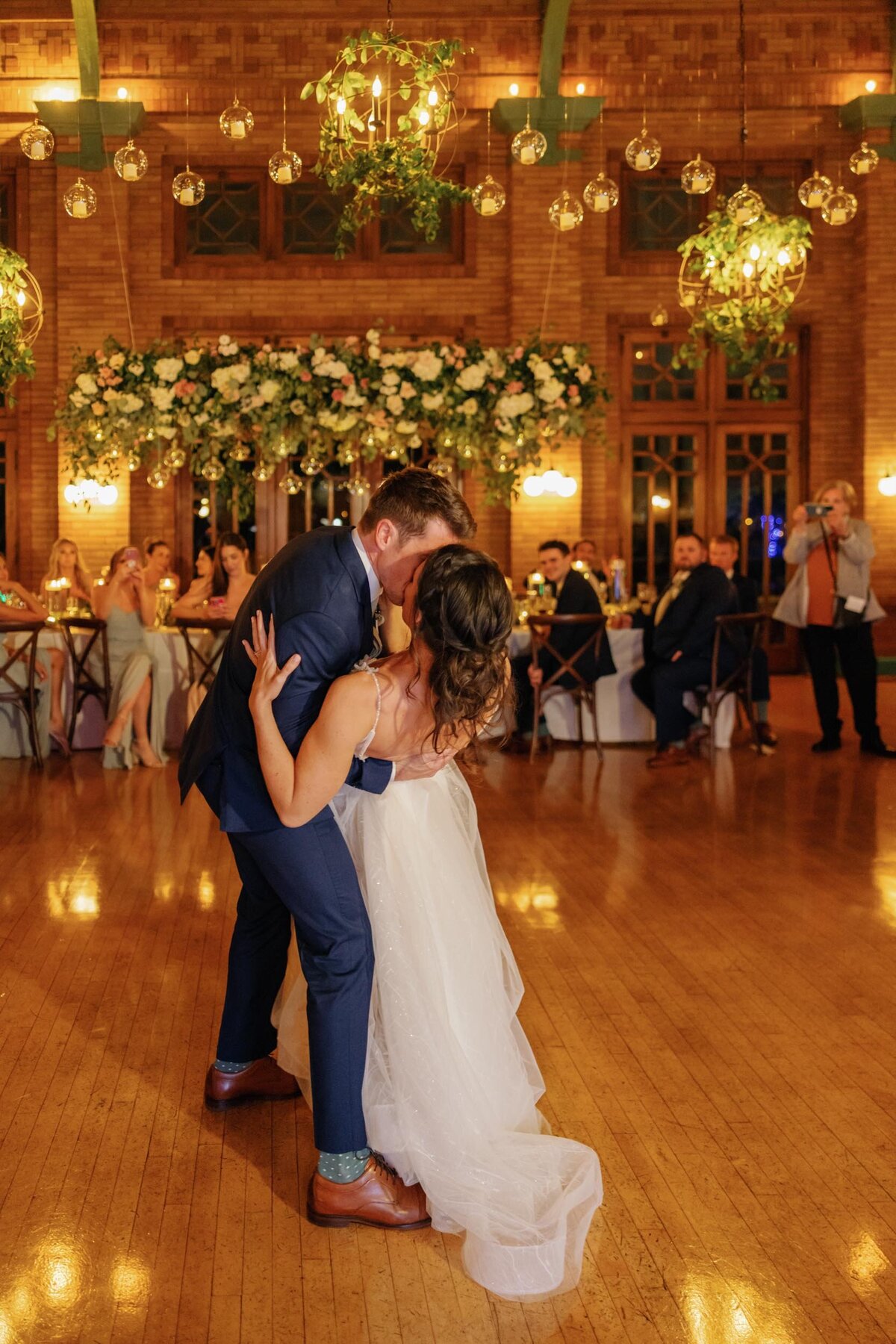 Bride and groom dips at the end of their first dance