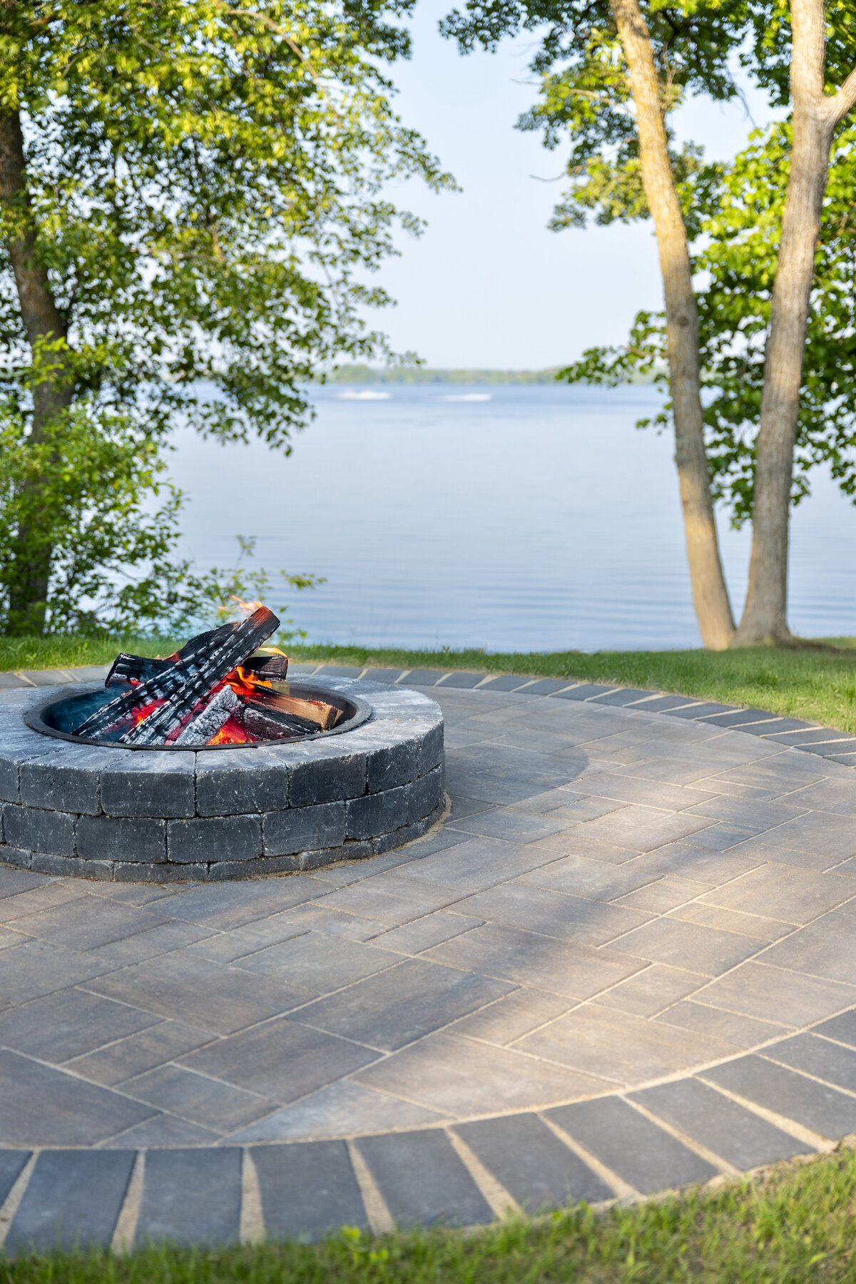 Backyard entertaining patio with a natural stone fire pit