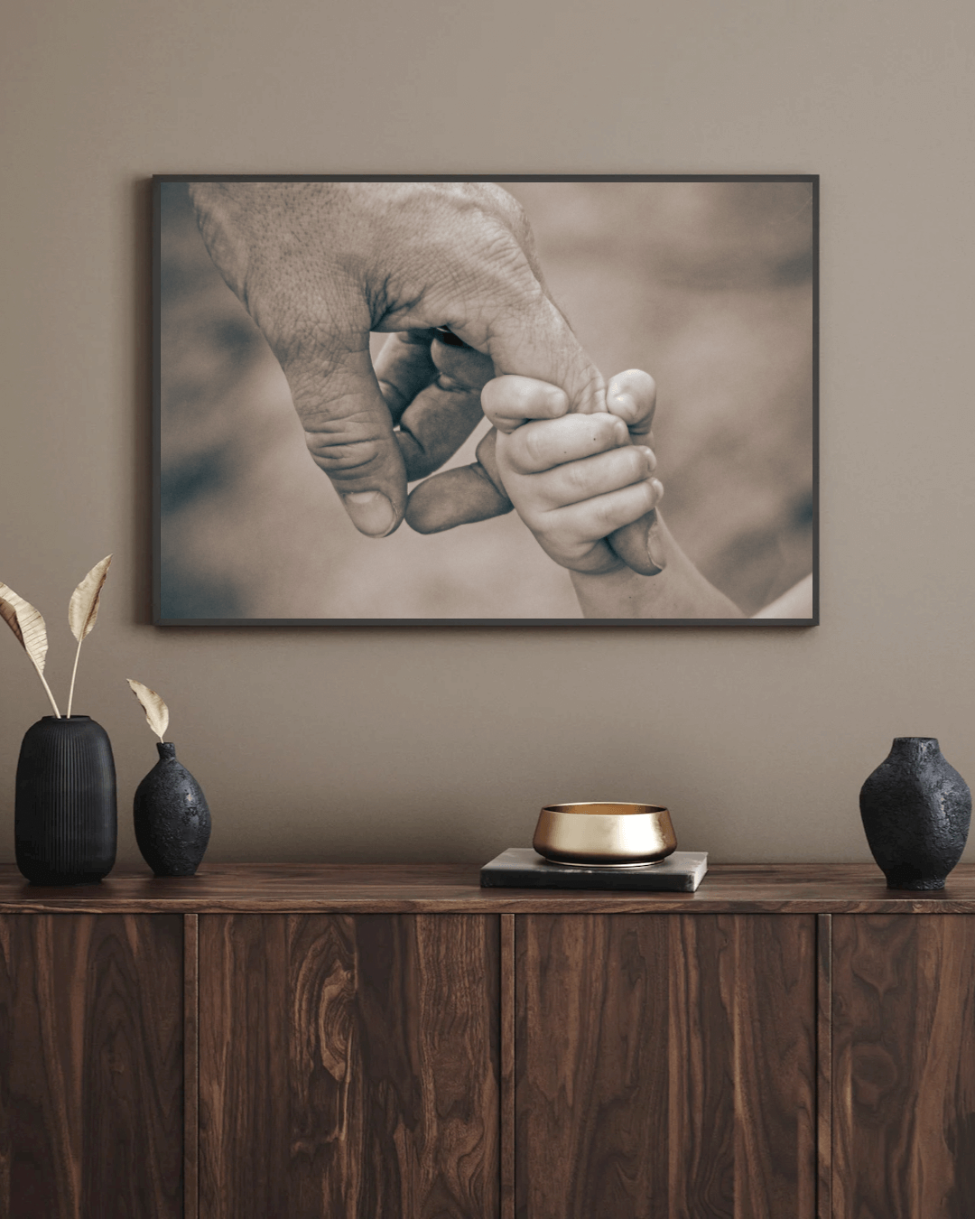 Strong image of Son holding his dads finger