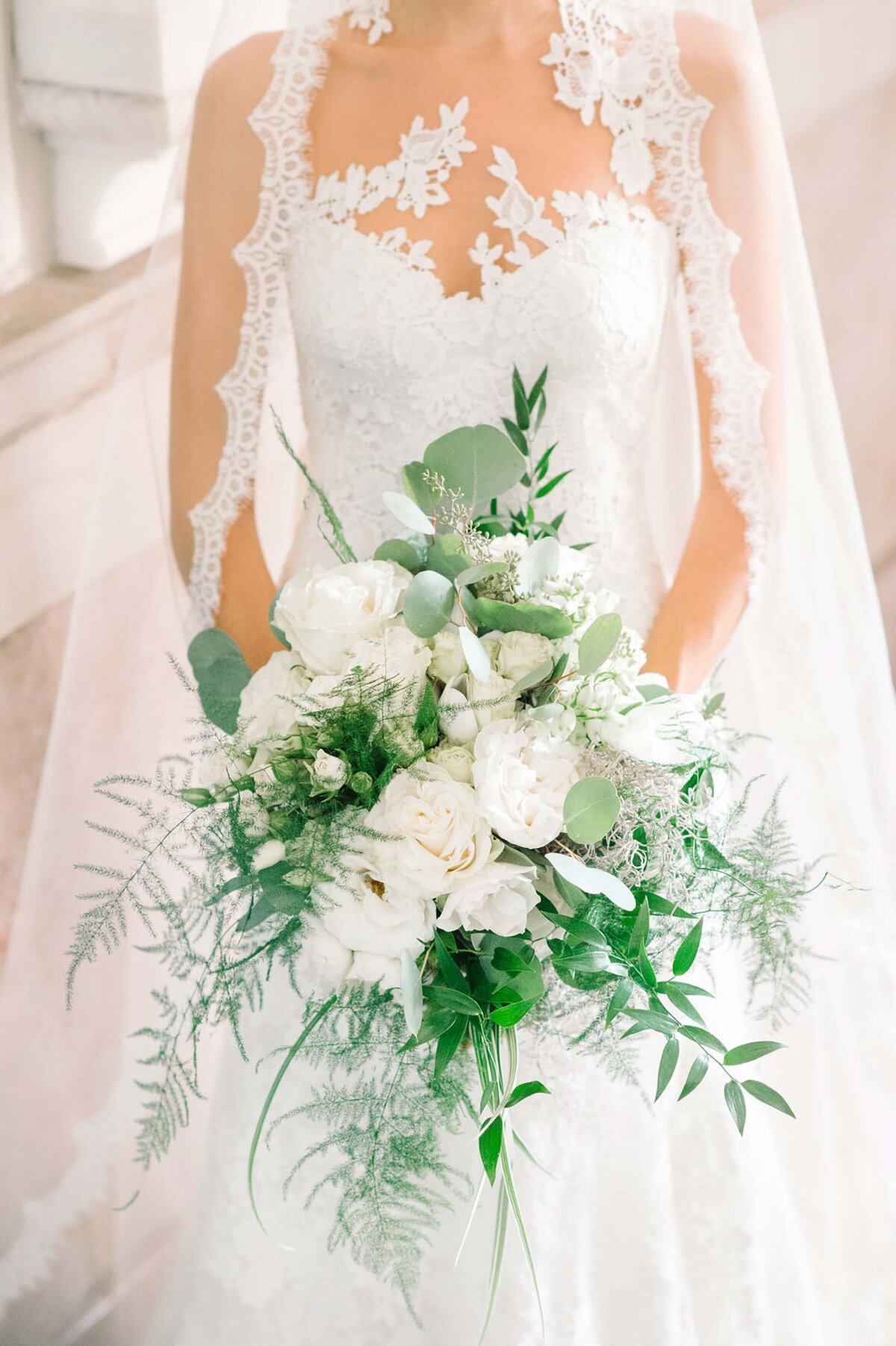 bride with her white bouquet