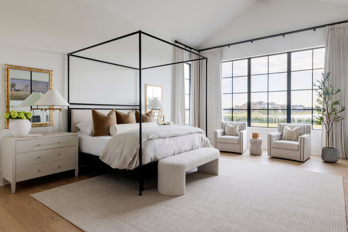 oyster creek studios hughes black canopy bed with white side table and brown pillows