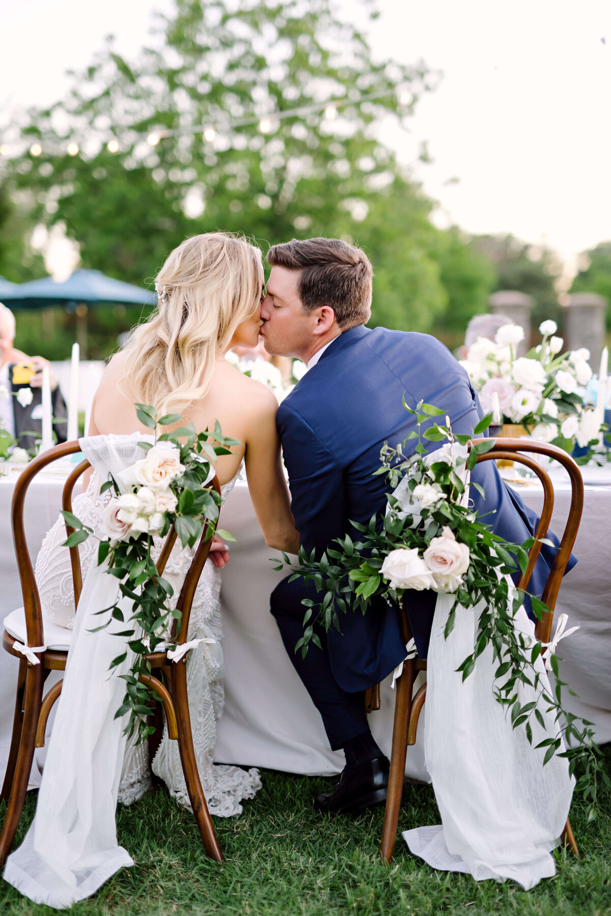 Couple kissing at their outdoor elopement reception