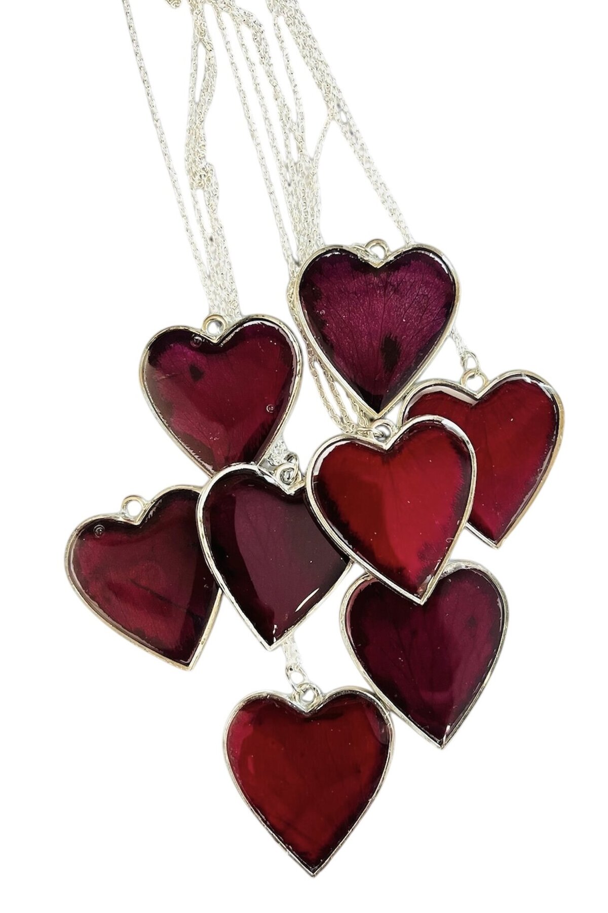 resin necklaces with burgundy funeral flowers preserved as a family heirloom and a great way to remember a loved one