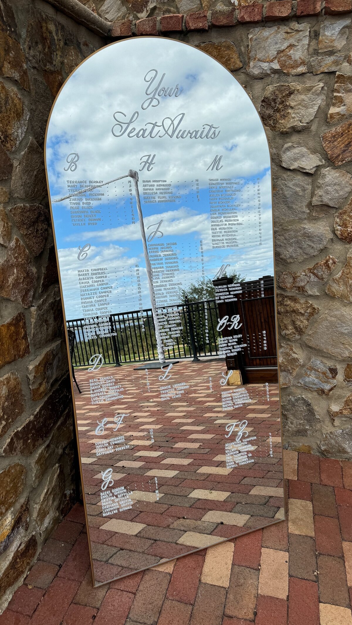 Large gold arch mirror with calligraphy for seating chart