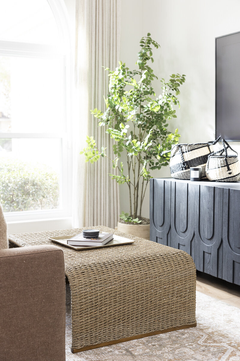 dewine design orlando interior designer belle isle living room with tree in corner and black table