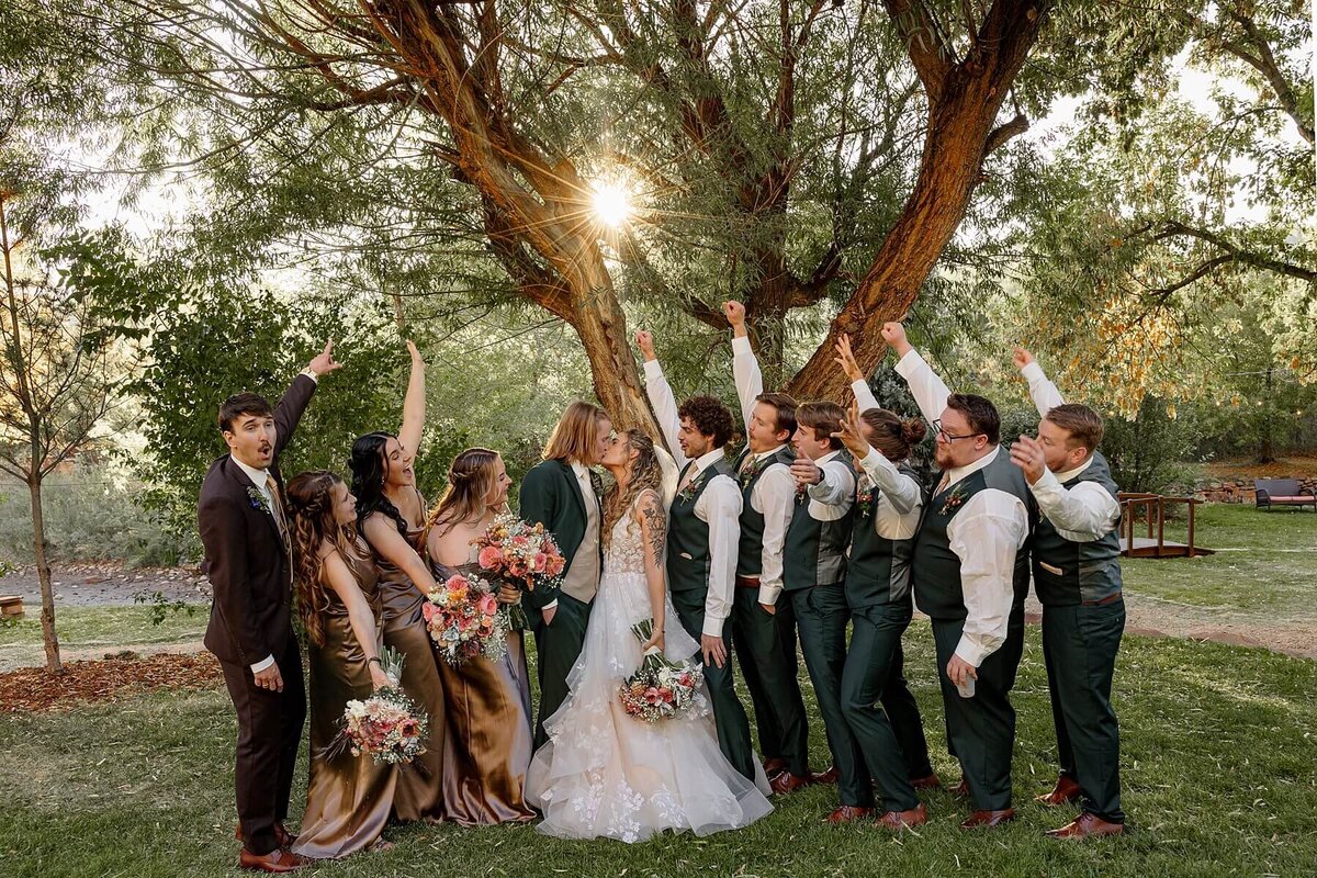 wedding party celebrating the bride and groom getting married in Colorado