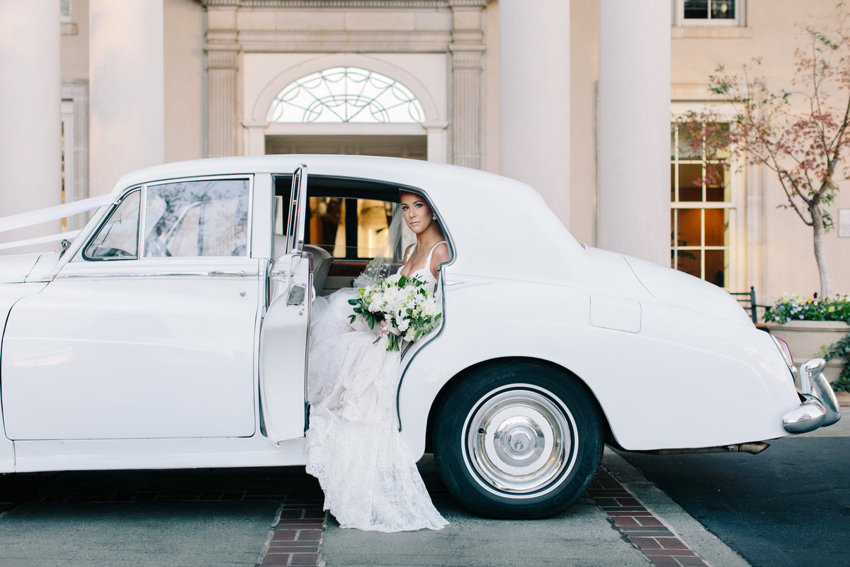 Vintage get away cars at weddings can create a timeless look in your photos.  Real wedding at the Biltmore Atlanta captured by Rebecca Cerasani.