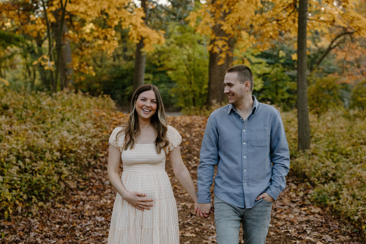 pregnant woman and man walking