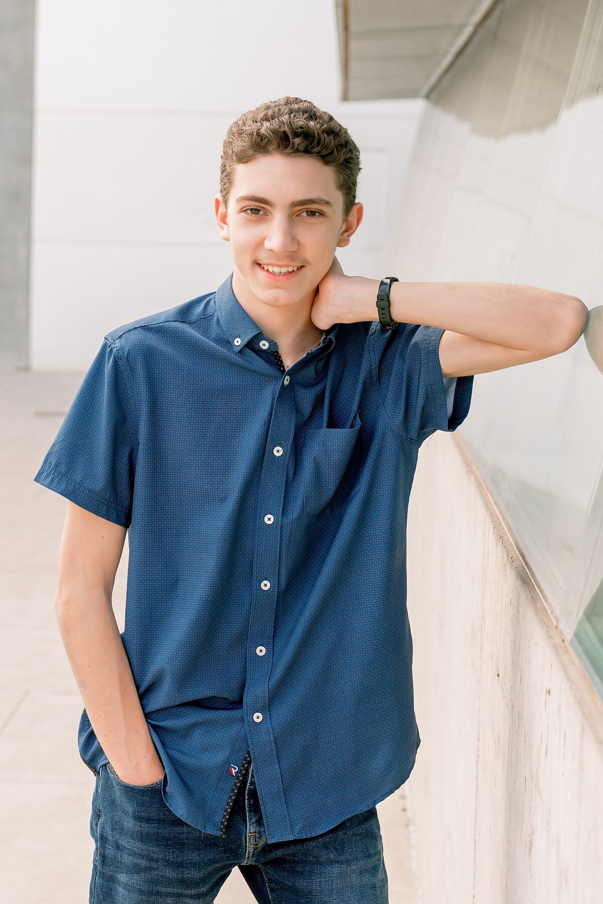 senior boy at arizona science center smiling at camera 
