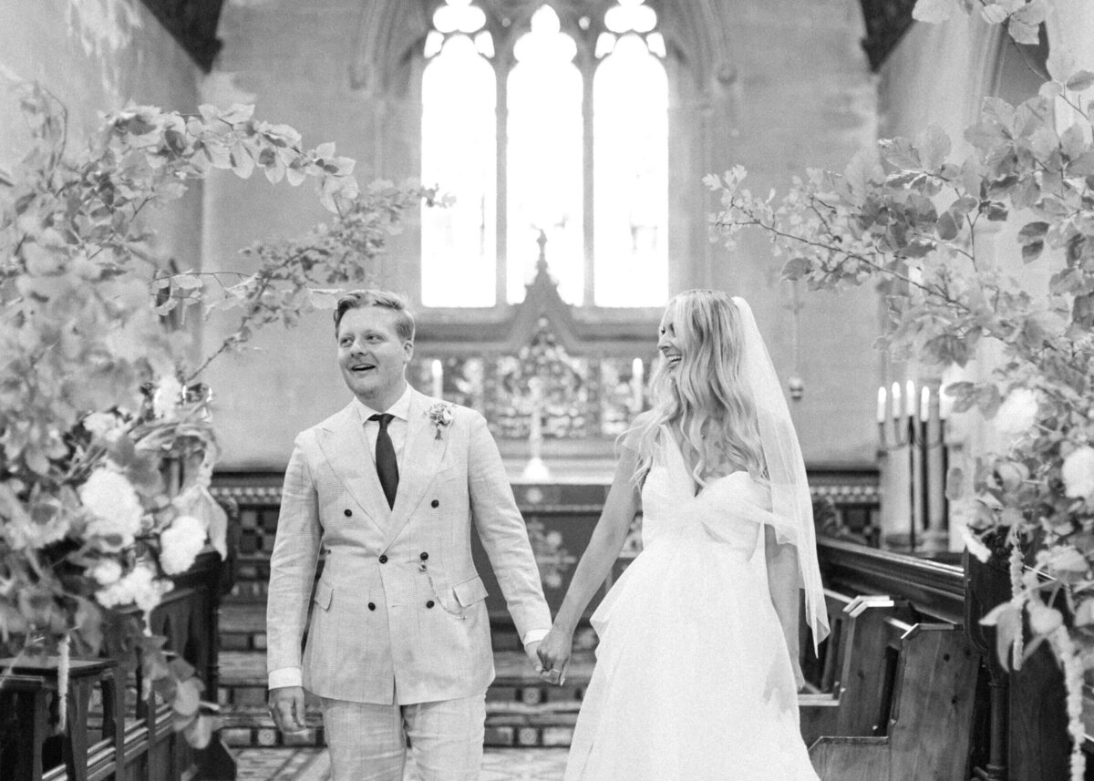 chloe-winstanley-weddings-church-ceremony-bride-groom-laughing
