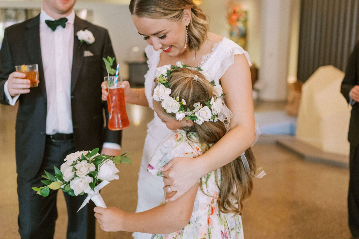 bride-hugging-flower-girl