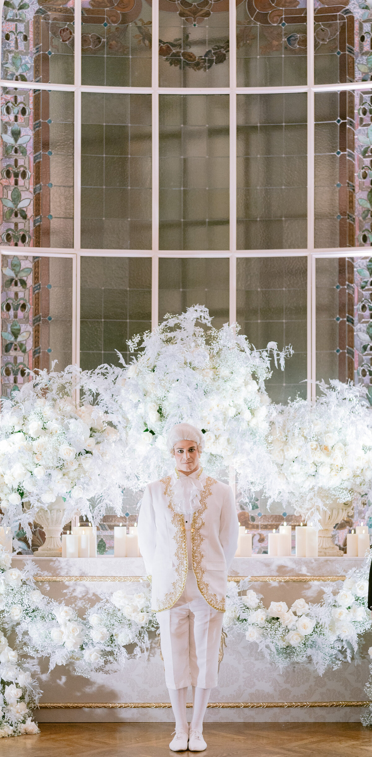 The captivating photo taken at the exquisite Shangri La Hotel & Ritz Paris Hotel in Paris, France features a person dressed in an elaborate white costume. The photo was beautifully captured by renowned photographer Matteo Coltro. To further enhance the information, I have added Zen Film Works as videographers to the details. Feel free to let me know if there's anything else you'd like to add or modify.