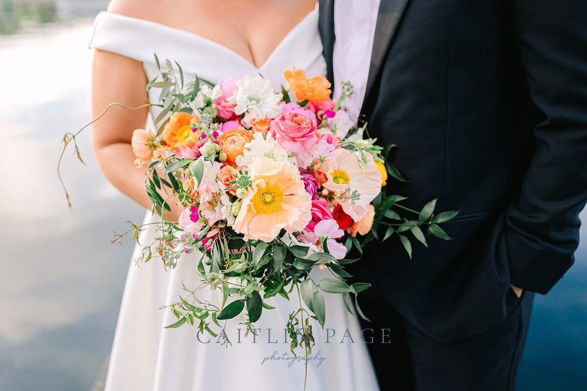 Summertime florals with peonies, poppies, ranunculus, ruscus, sweet peas and local flowers