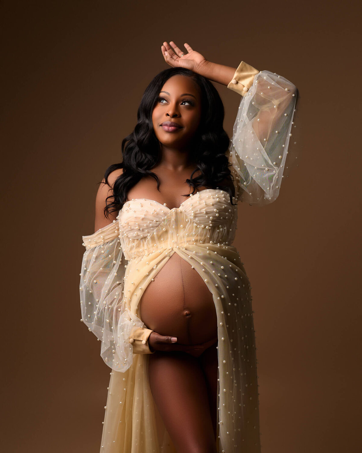 woman wearing open belly ivory pearl dress