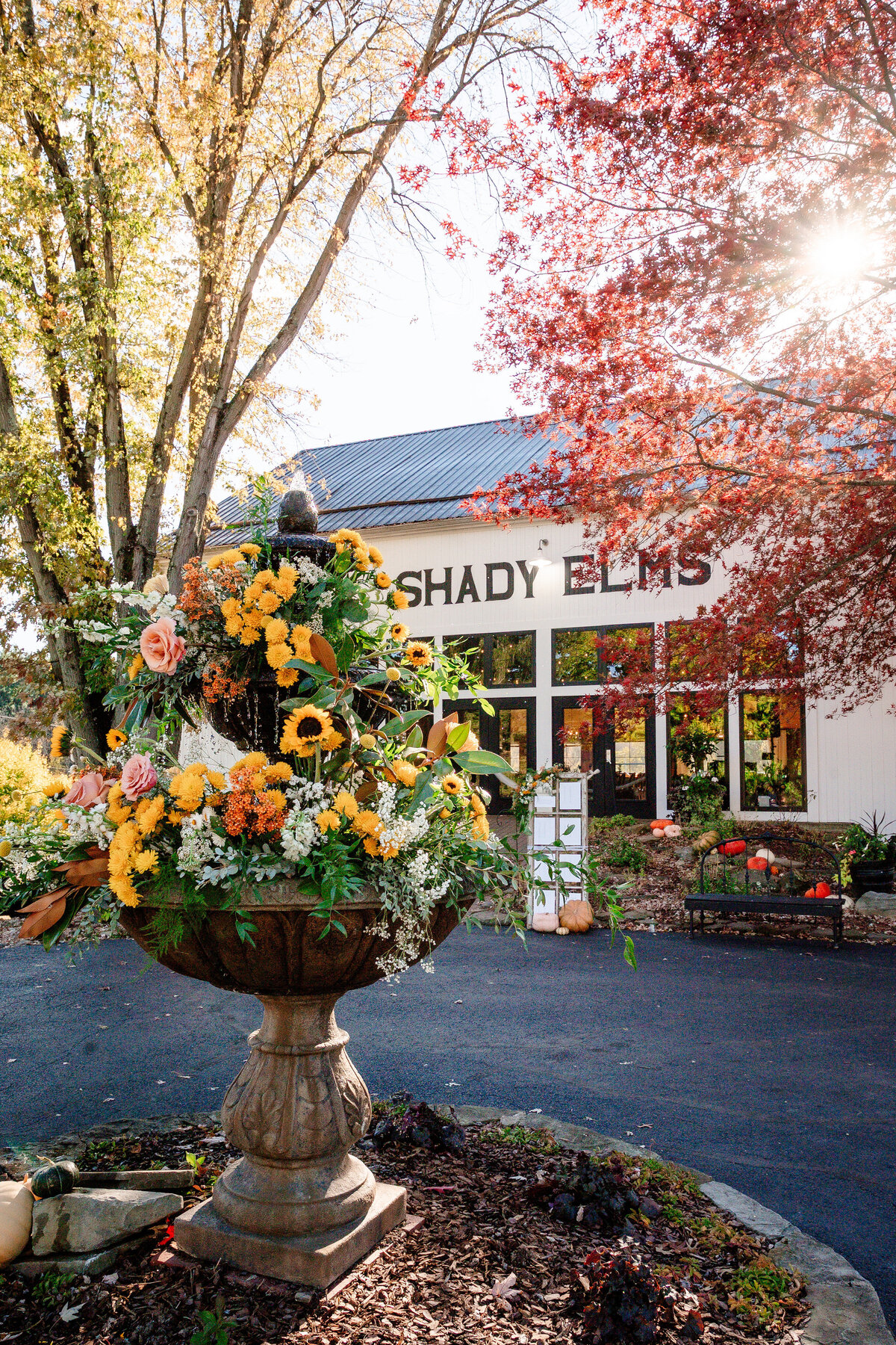 fountain at shady elms farm decorated with tons of flowers