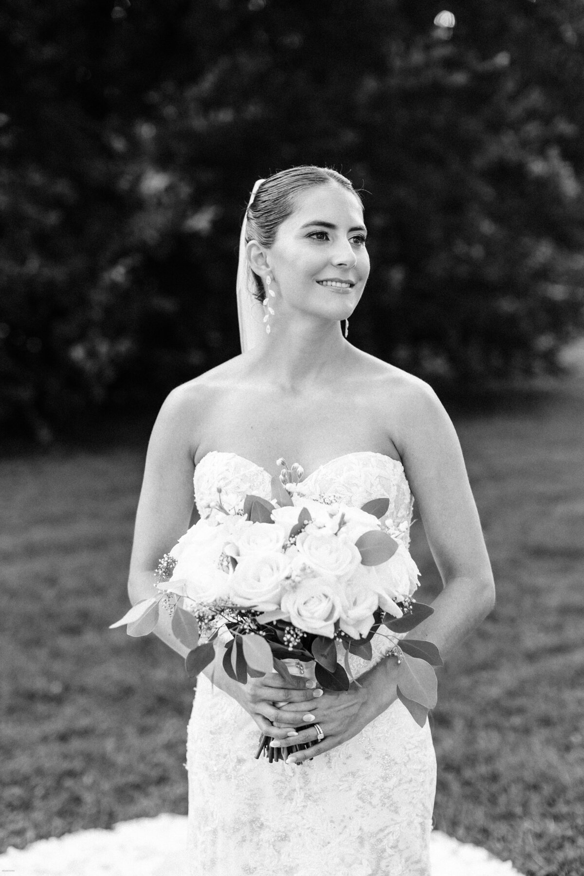 Bride holding bouquet of white florals