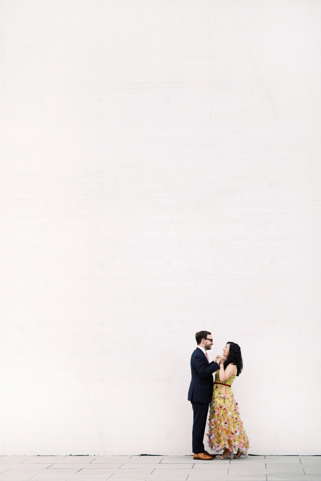 DC wedding photographer photographs a stylish couple during a modern engagement session at the Kennedy Center.