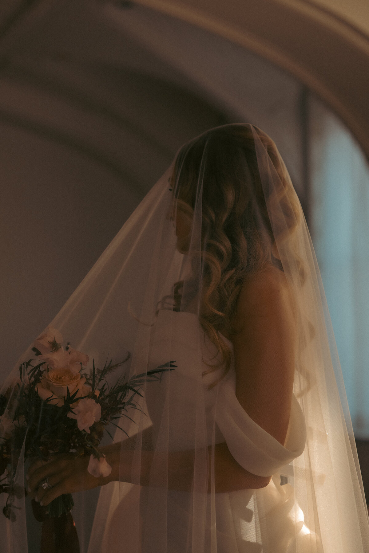 "Bride and groom celebrate their elegant luxury wedding at the historic Cottonwood Hotel in Omaha, NE – timeless moments captured by Tori Nichole Photography. A perfect blend of sophistication, romance, and architectural charm, showcasing the couple's love story in an unforgettable setting.